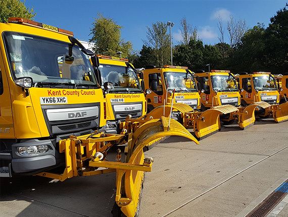 Row of parked gritting lorries